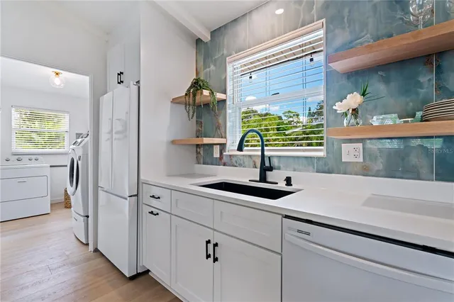 a kitchen with a sink and cabinets