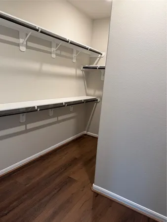 a view of an empty walk in closet