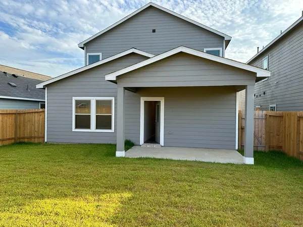 a front view of house with yard and garage