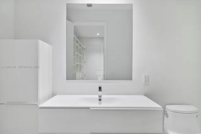 a bathroom with a shower and toilet
