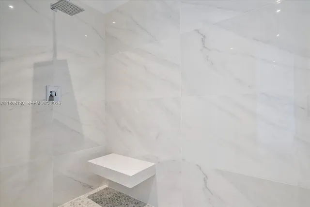 a bathroom with a shower and toilet