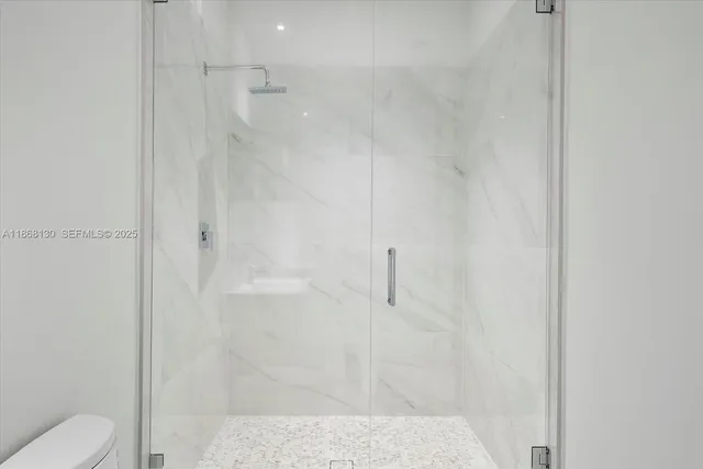 a view of an empty room with windows