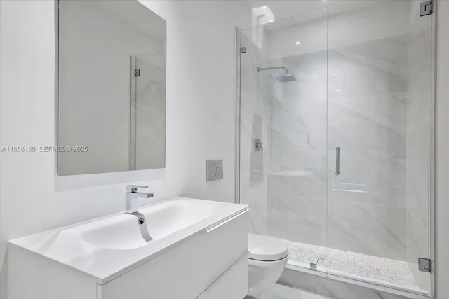 a bathroom with a shower and a sink