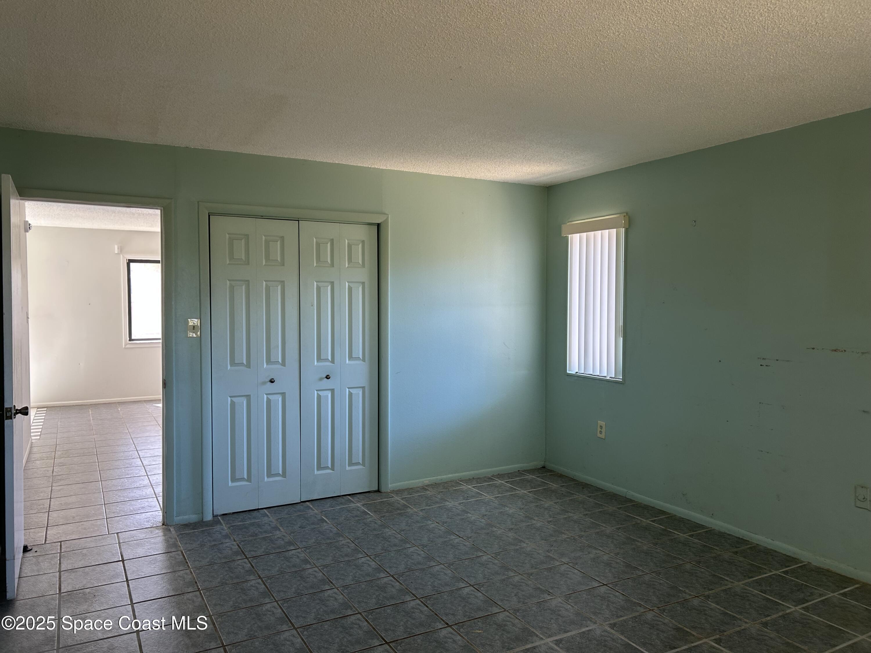 5 Fairway Drive, Unit 5 Cocoa Beach, FL 32931 - Photo 14 of 30 Spacious Bedroom