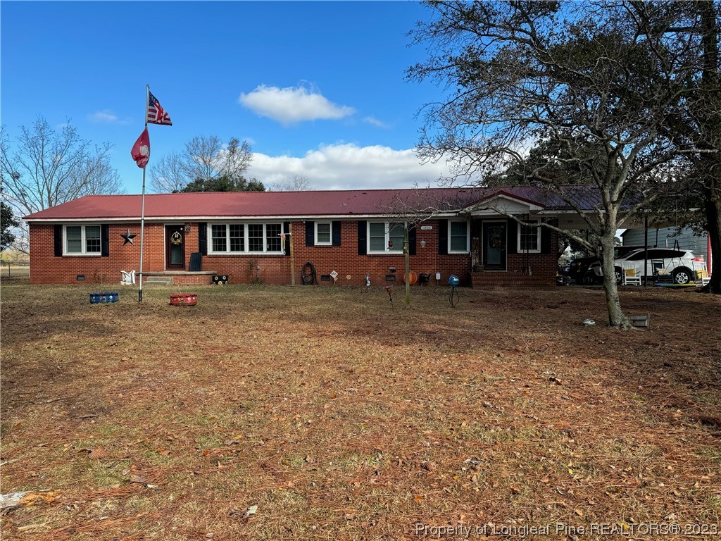 11828 Us Highway Maxton, NC 28364 - Photo 1 of 27 front view of a house with a yard
