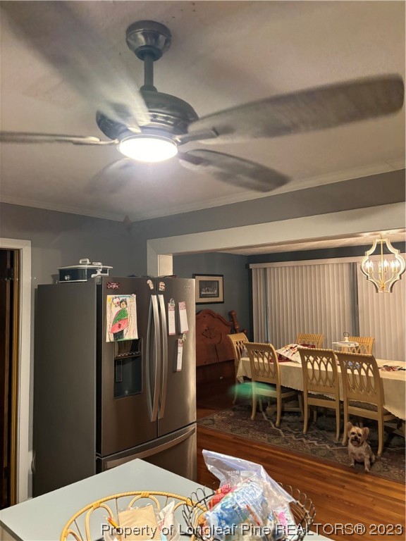 11828 Us Highway Maxton, NC 28364 - Photo 13 of 27 a bedroom with furniture and a chandelier