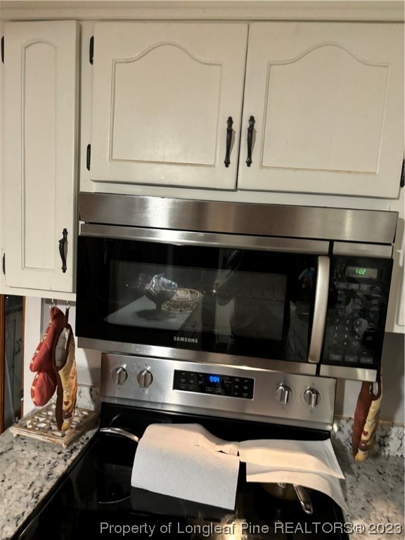 11828 Us Highway Maxton, NC 28364 - Photo 16 of 27 a stove top oven sitting inside of a kitchen