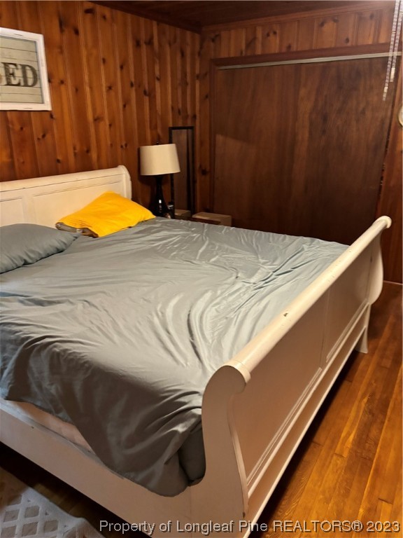 11828 Us Highway Maxton, NC 28364 - Photo 23 of 27 a bed sitting in a bedroom next to a cabinet