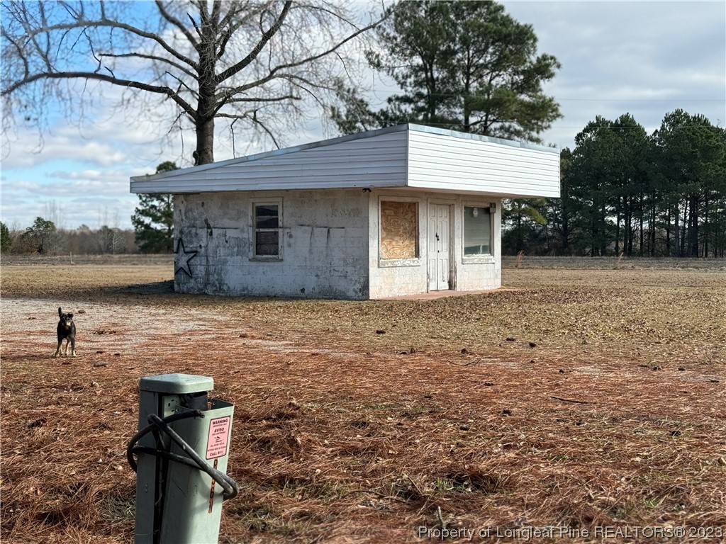 11828 Us Highway Maxton, NC 28364 - Photo 4 of 27 a front view of a house with lake