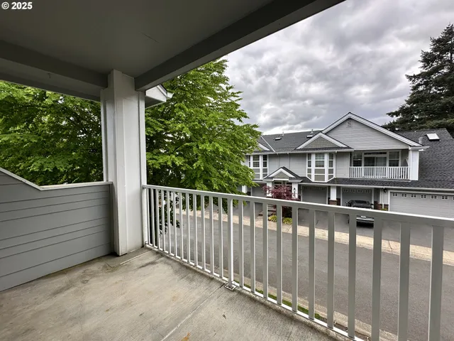 a view of a house with porch and wooden floor