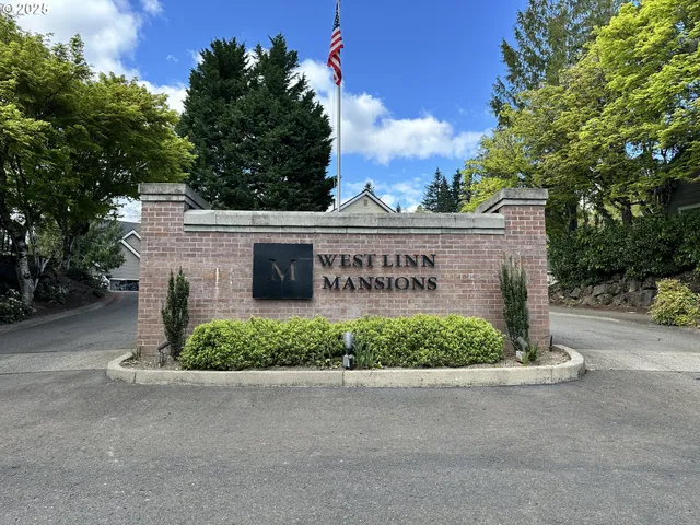 a view of a street sign of a house