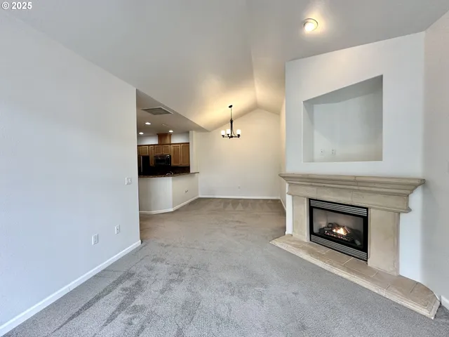 a view of a livingroom with a fireplace and a fireplace