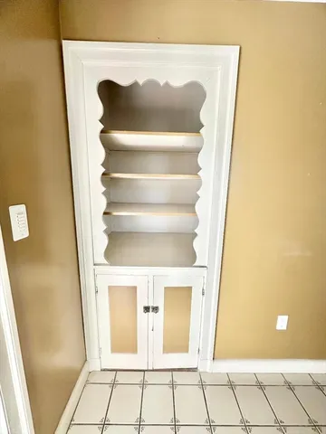 a view of a livingroom with furniture and a flat screen tv