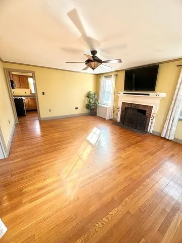 a view of a livingroom with furniture and a flat screen tv