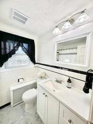 a bathroom with a sink and a window