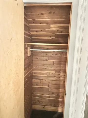 a building outdoor space with patio furniture and potted plants