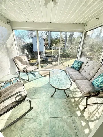 a living room with a couch and a large window