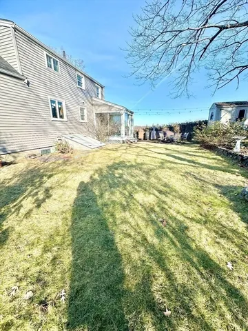 a front view of residential houses with yard and swimming pool
