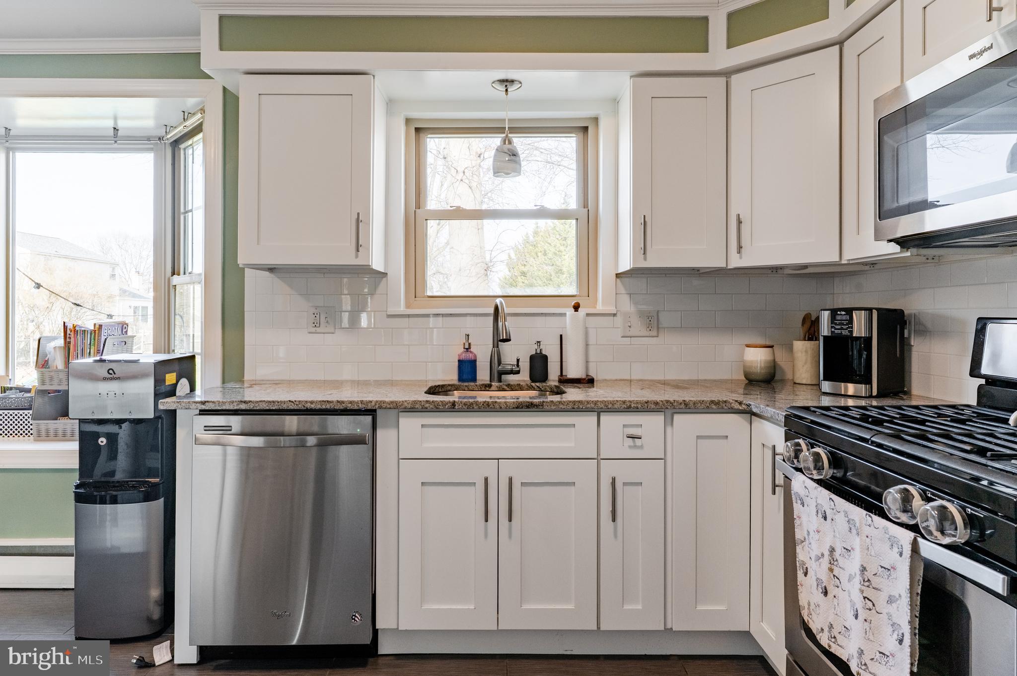 2288 Bramble Gate Drive Hatfield, PA 19440 - Photo 11 of 52 a kitchen with stainless steel appliances granite countertop a stove a sink and white cabinets