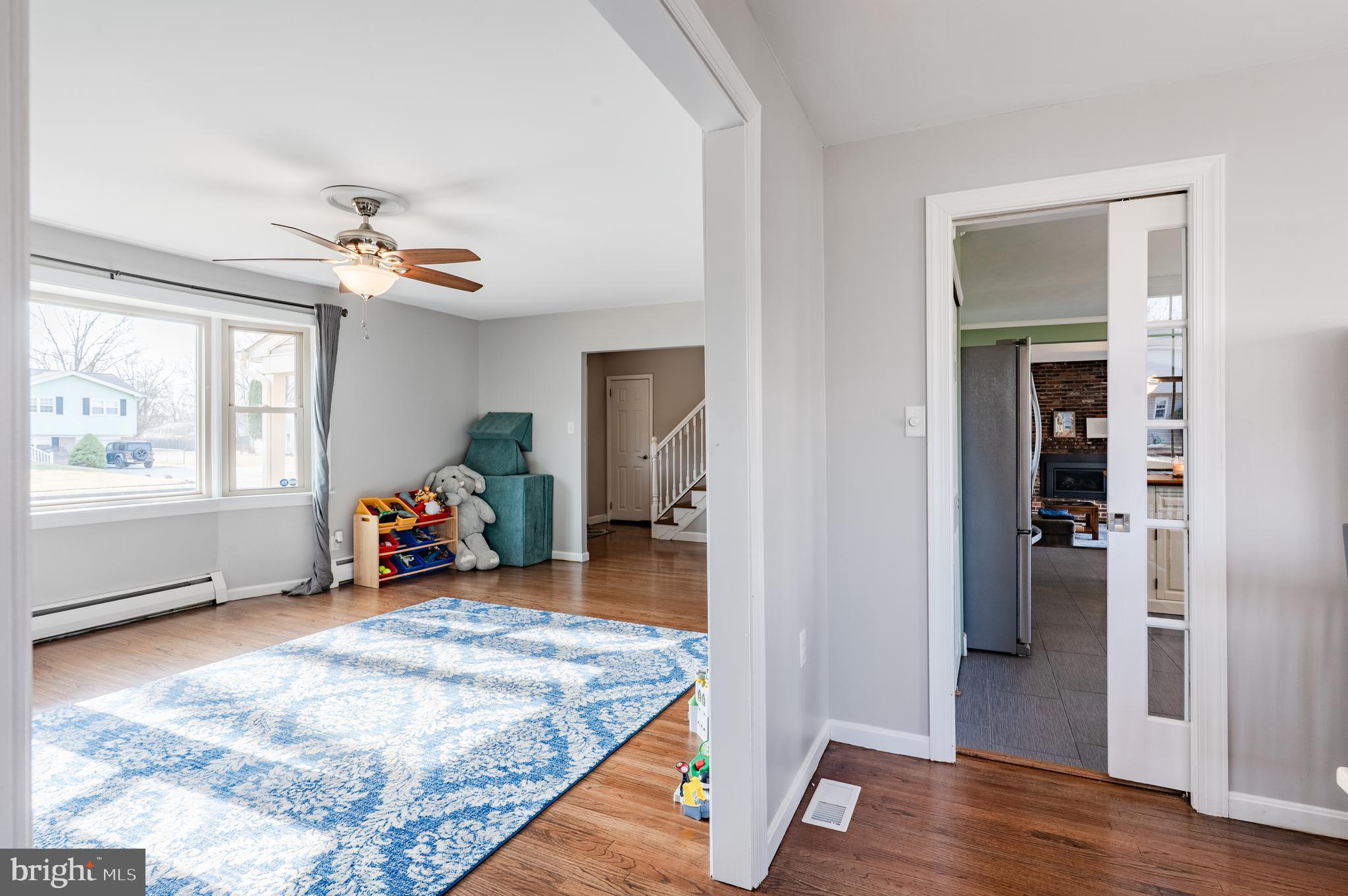 2288 Bramble Gate Drive Hatfield, PA 19440 - Photo 16 of 52 a view of a livingroom with wooden floor and a ceiling fan