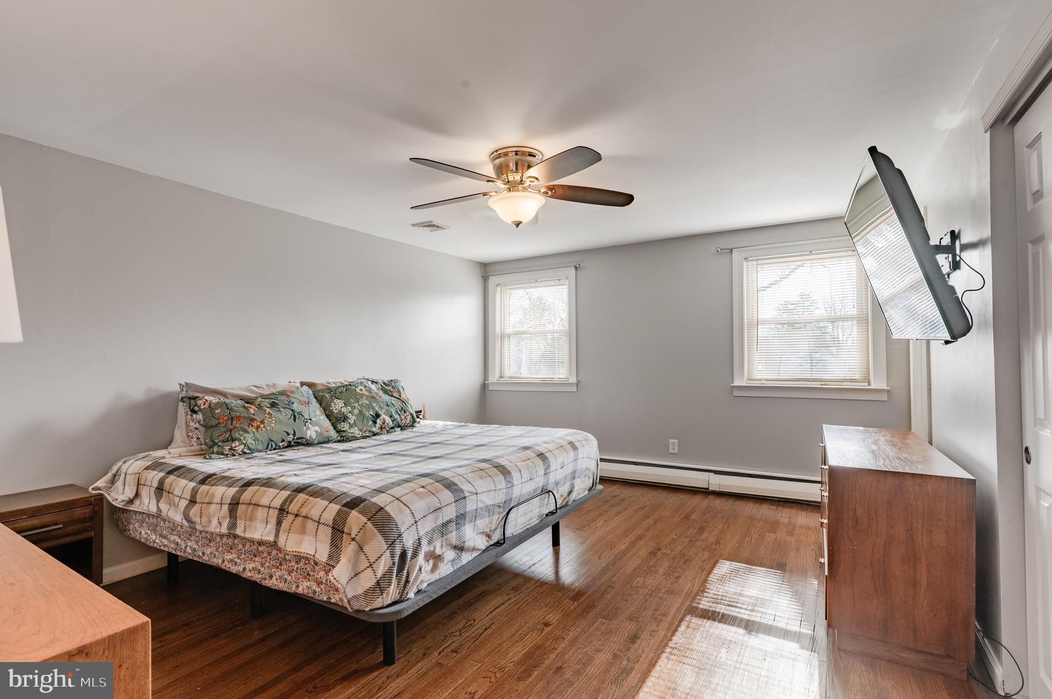 2288 Bramble Gate Drive Hatfield, PA 19440 - Photo 32 of 52 a bedroom with a bed and a chandelier