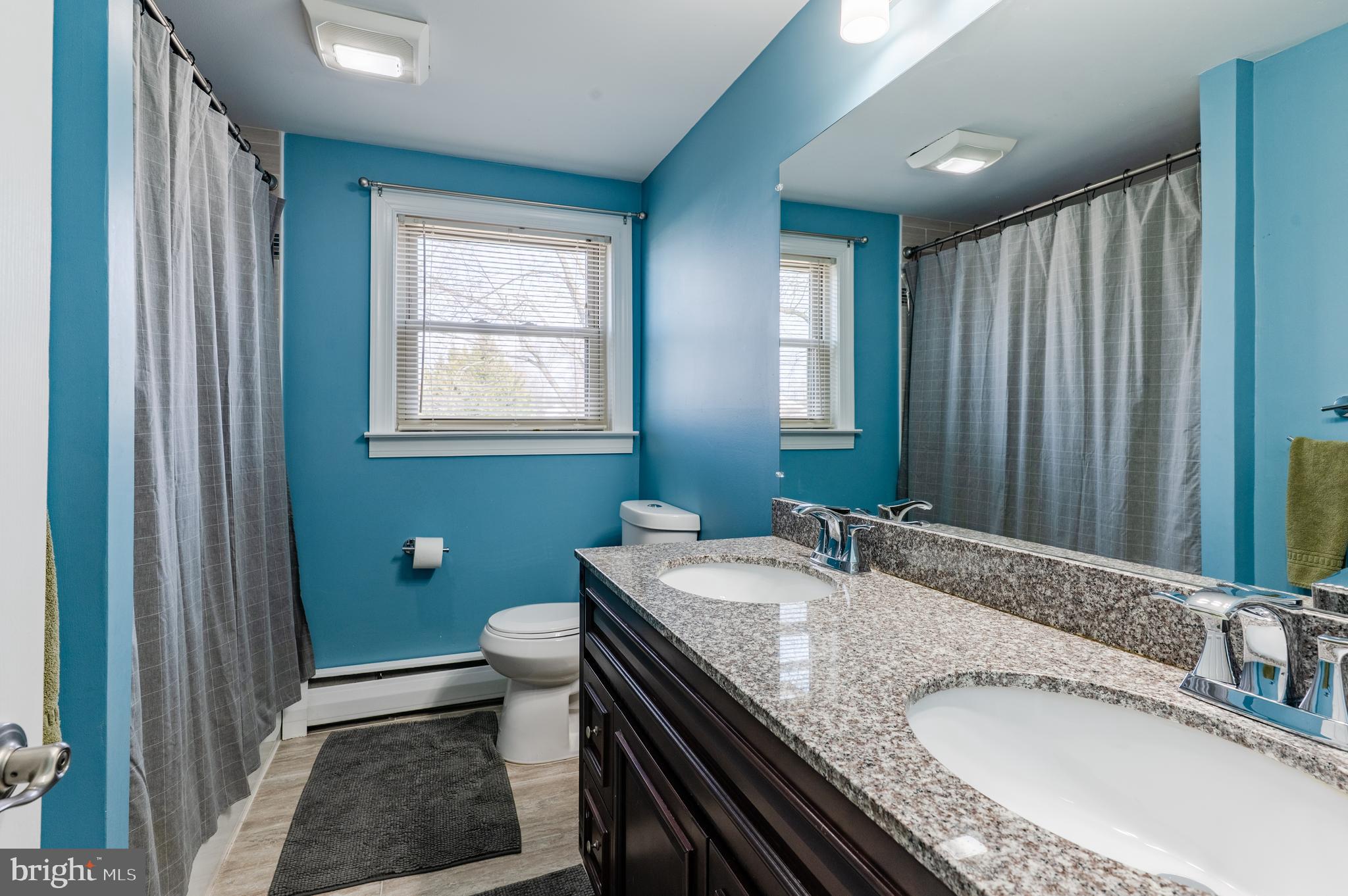 2288 Bramble Gate Drive Hatfield, PA 19440 - Photo 36 of 52 a bathroom with a granite countertop sink a toilet and mirror
