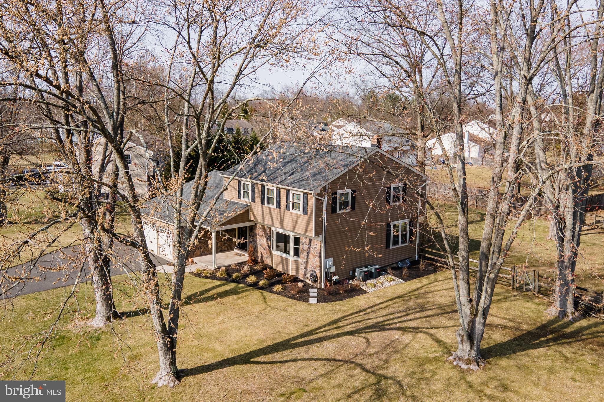 2288 Bramble Gate Drive Hatfield, PA 19440 - Photo 44 of 52 a view of a white house with a yard covered in the snow