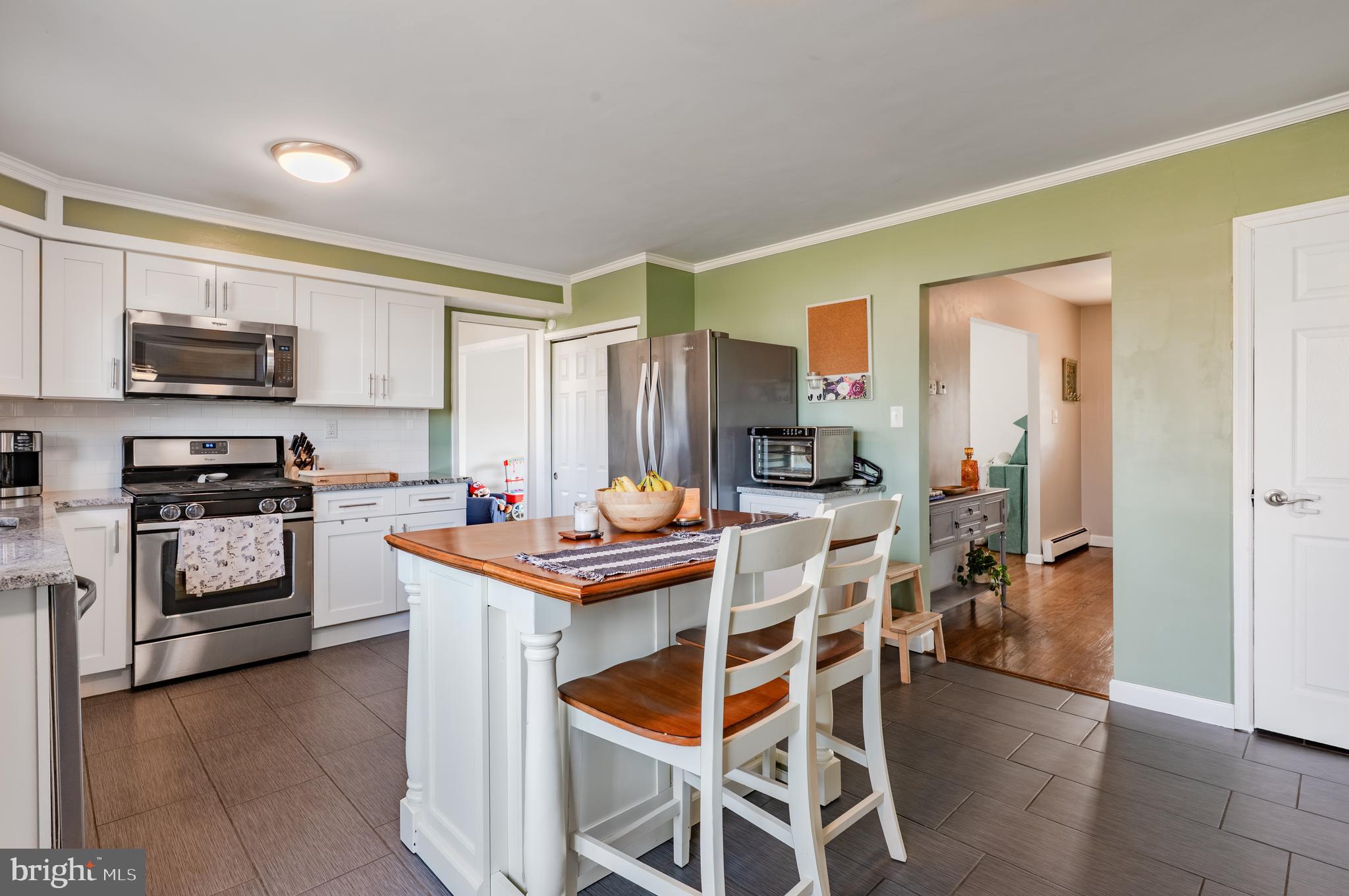 2288 Bramble Gate Drive Hatfield, PA 19440 - Photo 9 of 52 a kitchen with stainless steel appliances kitchen island granite countertop a sink and cabinets