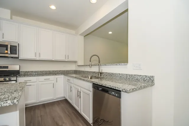 a kitchen with a sink and cabinets