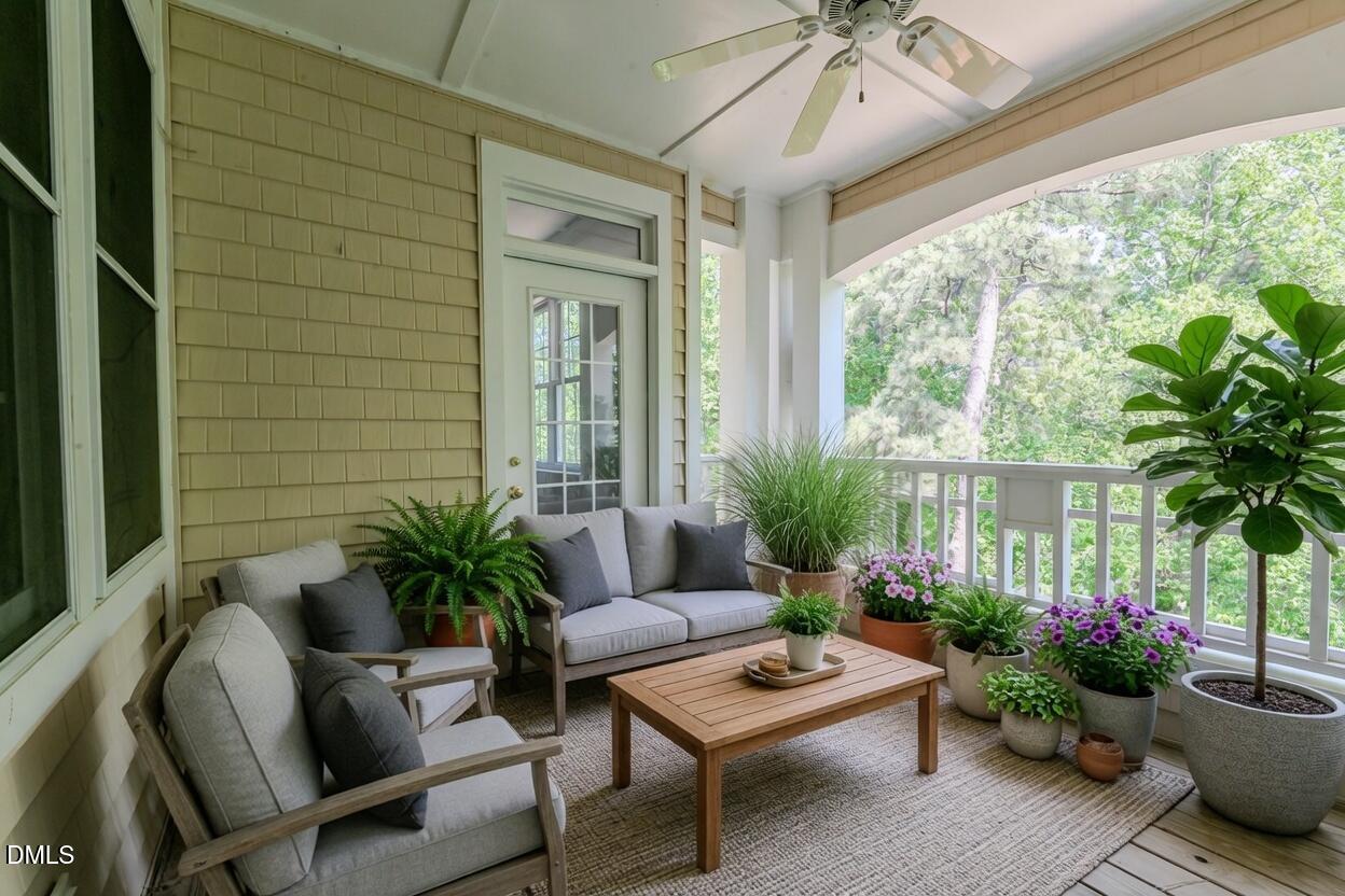 116 Northbrook Drive, Unit 305 Raleigh, NC 27609 - Photo 11 of 43 a living room with furniture and a potted plant