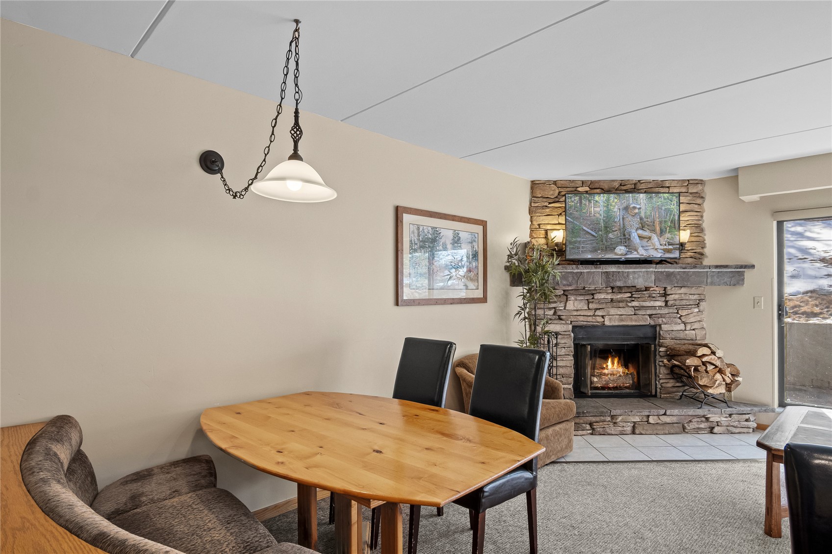 640 Village Road, Unit 4110 Breckenridge, CO 80424 - Photo 13 of 50 a living room with furniture and a fireplace