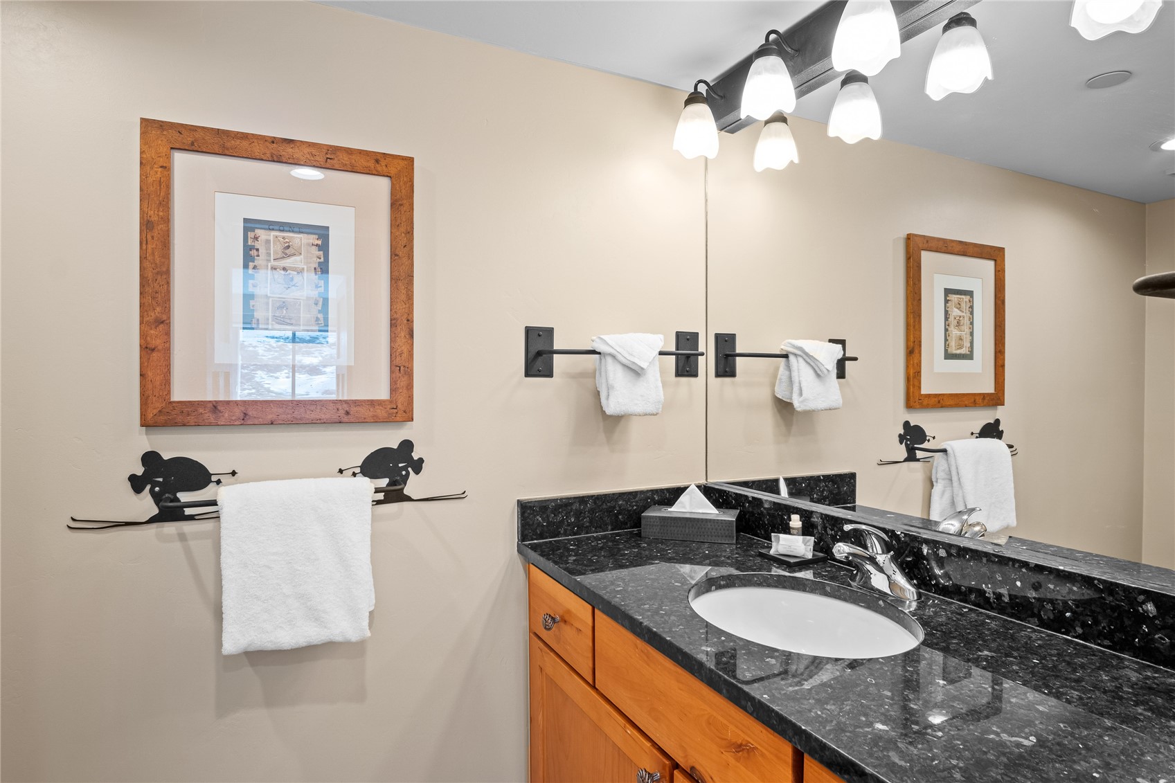 640 Village Road, Unit 4110 Breckenridge, CO 80424 - Photo 23 of 50 a bathroom with a granite countertop sink a mirror and vanity