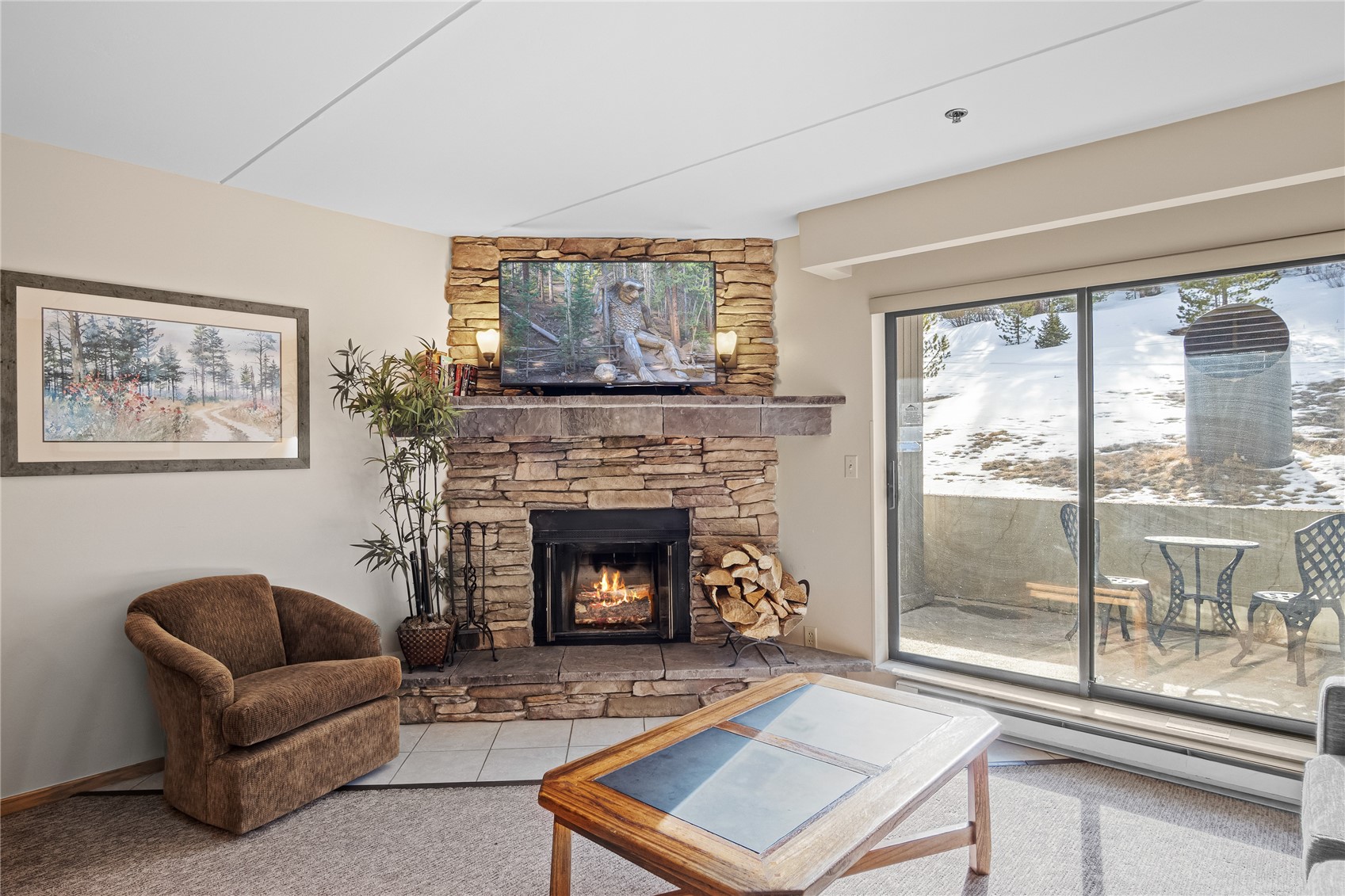 640 Village Road, Unit 4110 Breckenridge, CO 80424 - Photo 7 of 50 a living room with furniture and a fireplace