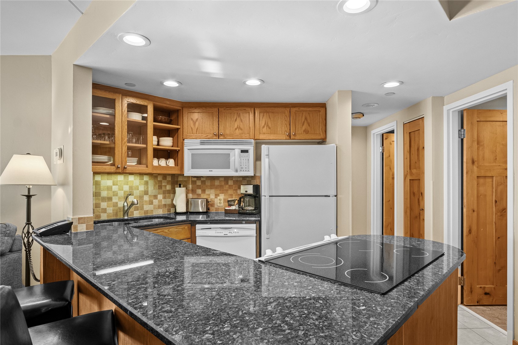 640 Village Road, Unit 4110 Breckenridge, CO 80424 - Photo 9 of 50 a kitchen with stainless steel appliances granite countertop a sink a stove and a refrigerator