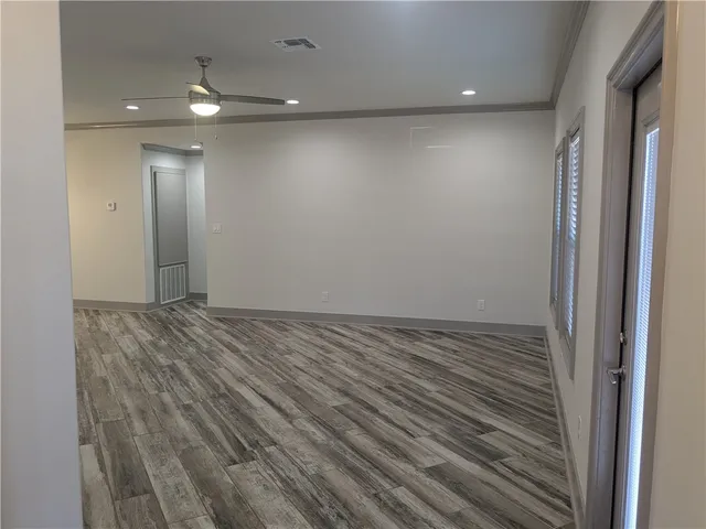 a view of a livingroom with wooden floor
