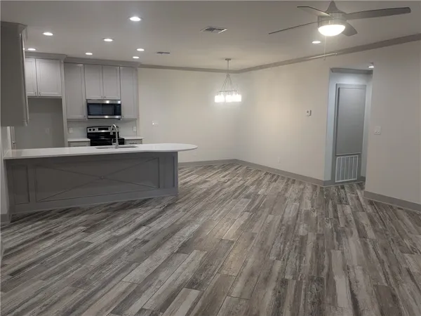 a view of kitchen with microwave and stove