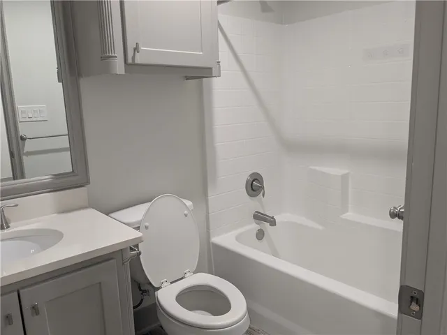 a bathroom with a sink and toilet