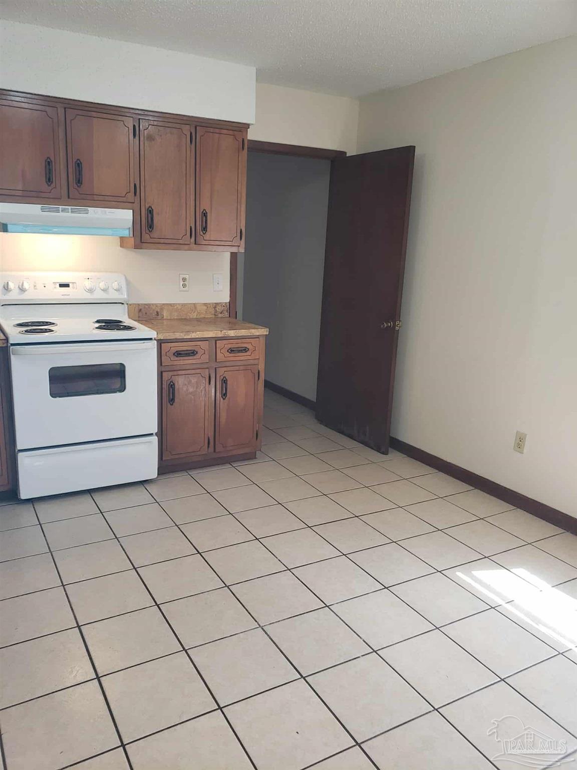 820 Calhoun Avenue, Unit A Pensacola, FL 32507 - Photo 1 of 9 a kitchen with a cabinets and white appliances