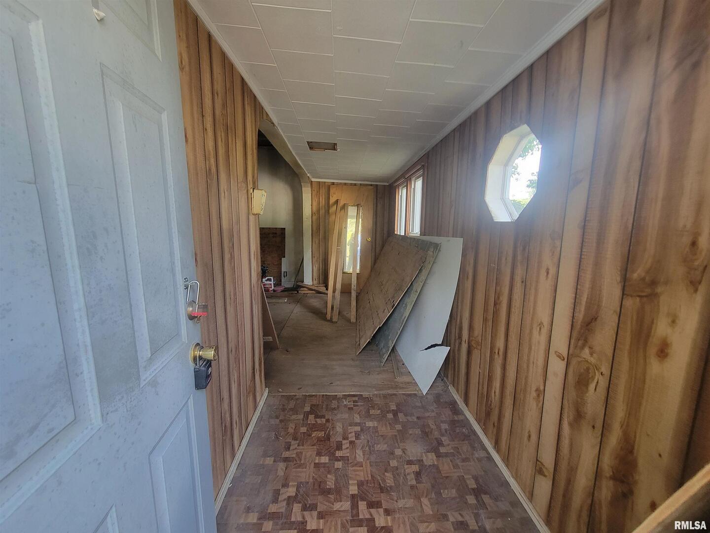 600 South 25th Street Herrin, IL 62948 - Photo 6 of 15 a view of a hallway with wooden floor and stairs