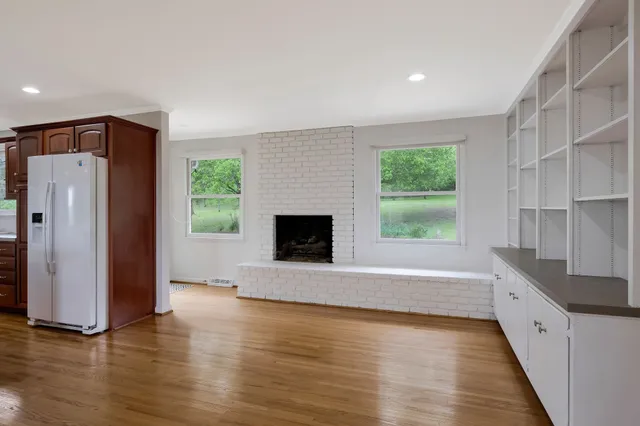 a view of kitchen with furniture and wooden floor