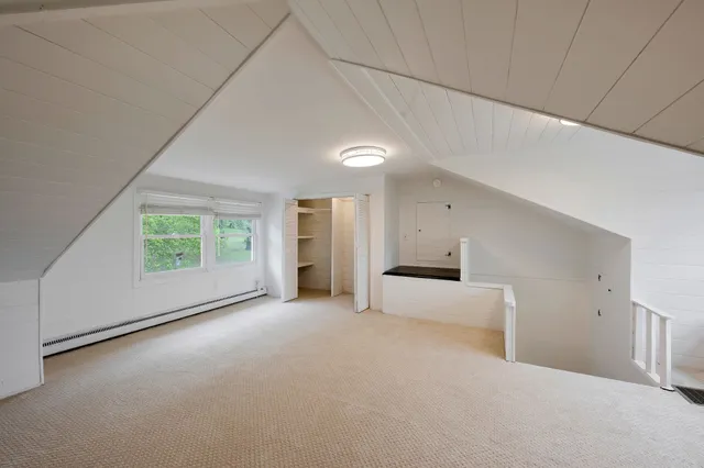 a big room with closet and windows