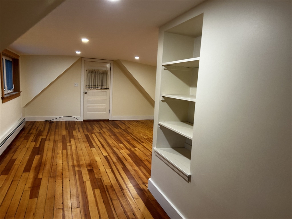 46 Elm Street, Unit 2 Buckland, MA 01370 - Photo 4 of 15 a view of an empty room with wooden floor and closet