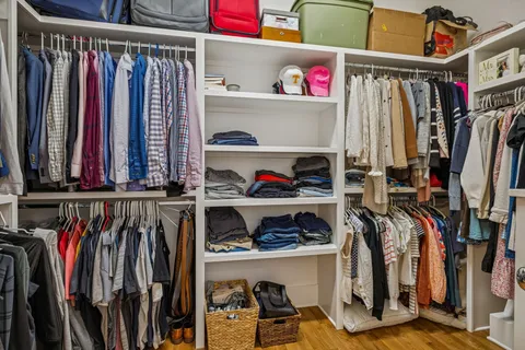 a bedroom with furniture and a window