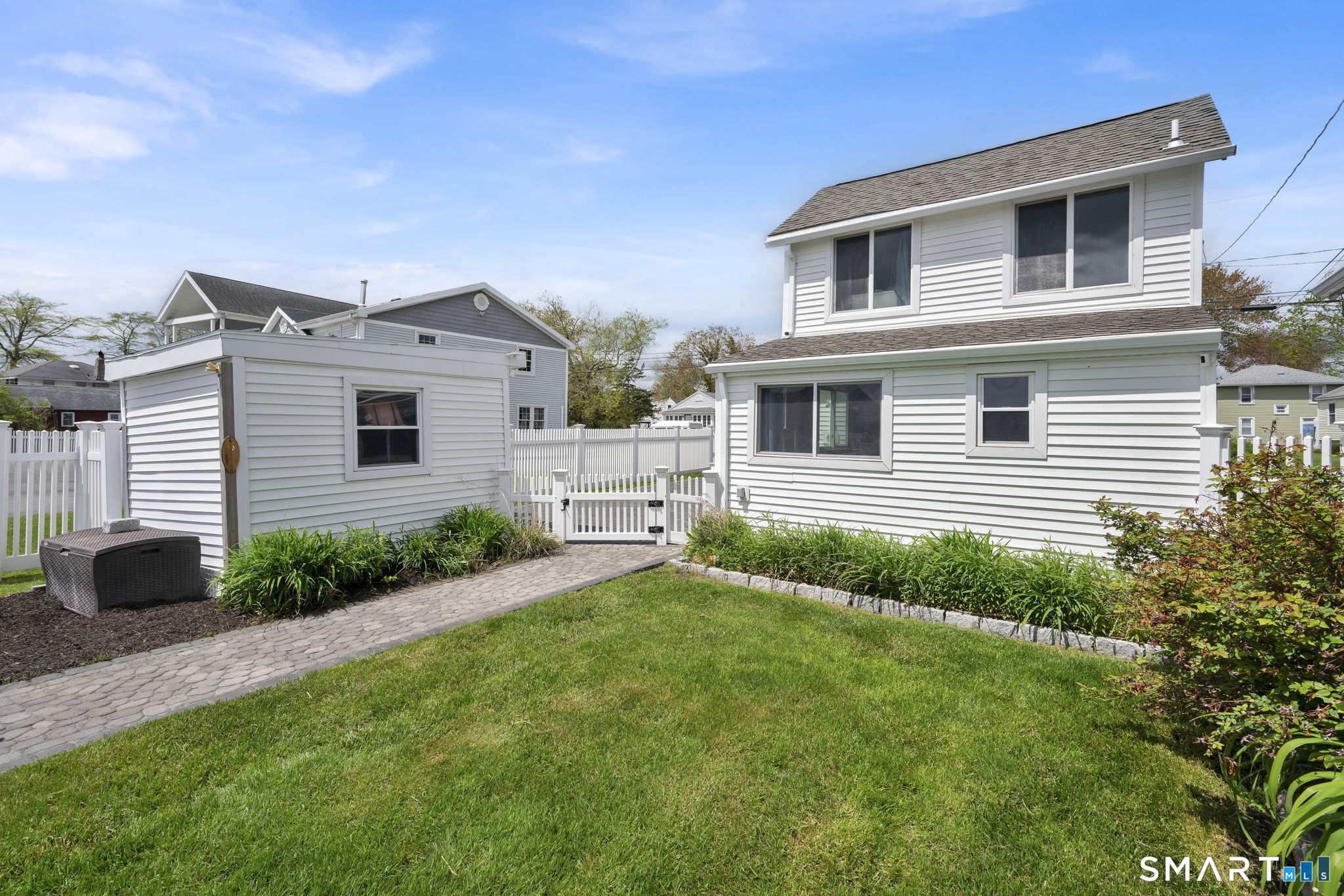 96 Chalker Beach Road Old Saybrook, CT 06475 - Photo 7 of 33 a house view with a garden space