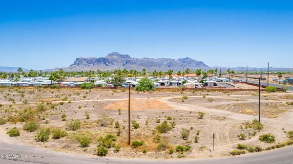 an aerial view of residential building and ocean view