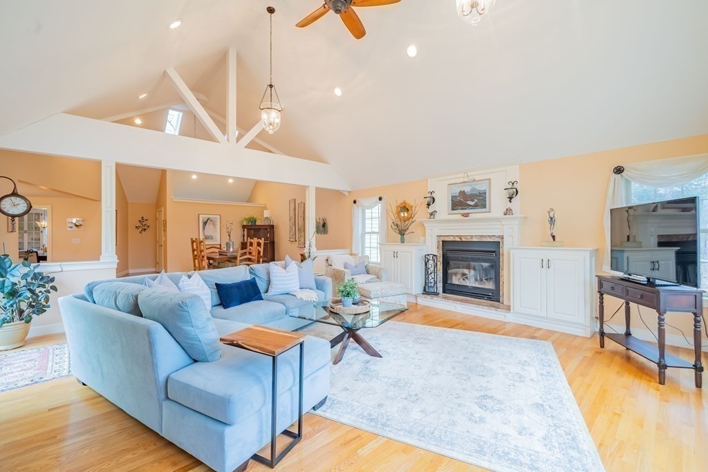 51 Robinson Road Lexington, MA 02420 - Photo 20 of 42 a living room with furniture a fireplace and a flat screen tv