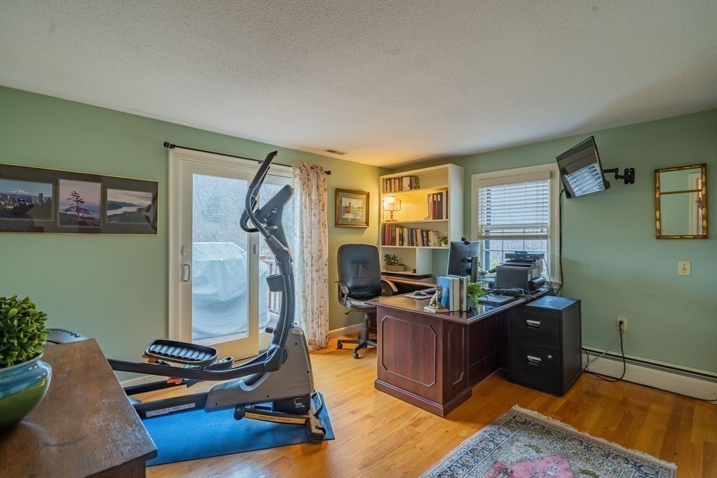 51 Robinson Road Lexington, MA 02420 - Photo 23 of 42 a room with furniture and a wooden floor
