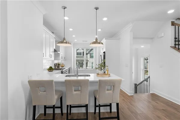 a dining room with furniture and a chandelier