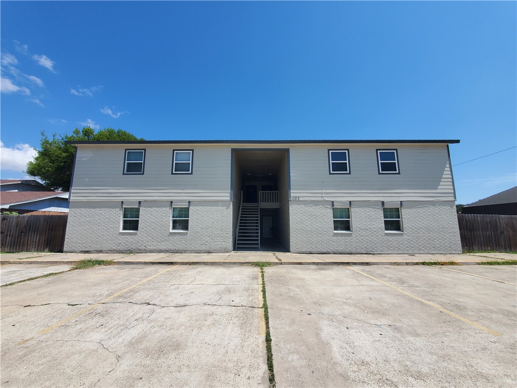 1102 Denver Street, Unit G Portland, TX 78374 - Photo 1 of 1 a front view of a house with a yard