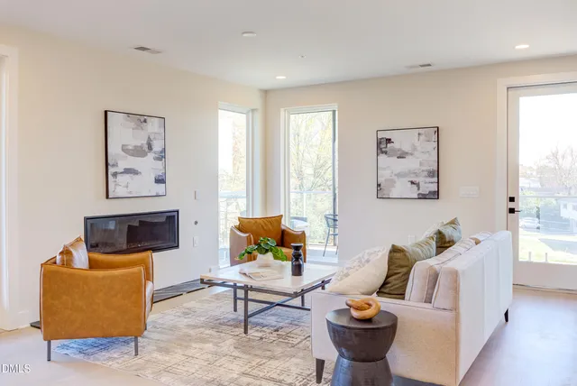 a kitchen with stainless steel appliances granite countertop a sink and a refrigerator